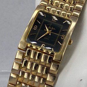 John Weitz Lady Watch Gold tones Black Face Gold Toned Numbers Gold Toned Metal